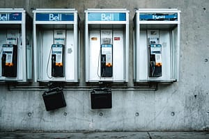 Vintage Bell telephone booths on a Toronto street representing urban nostalgia.